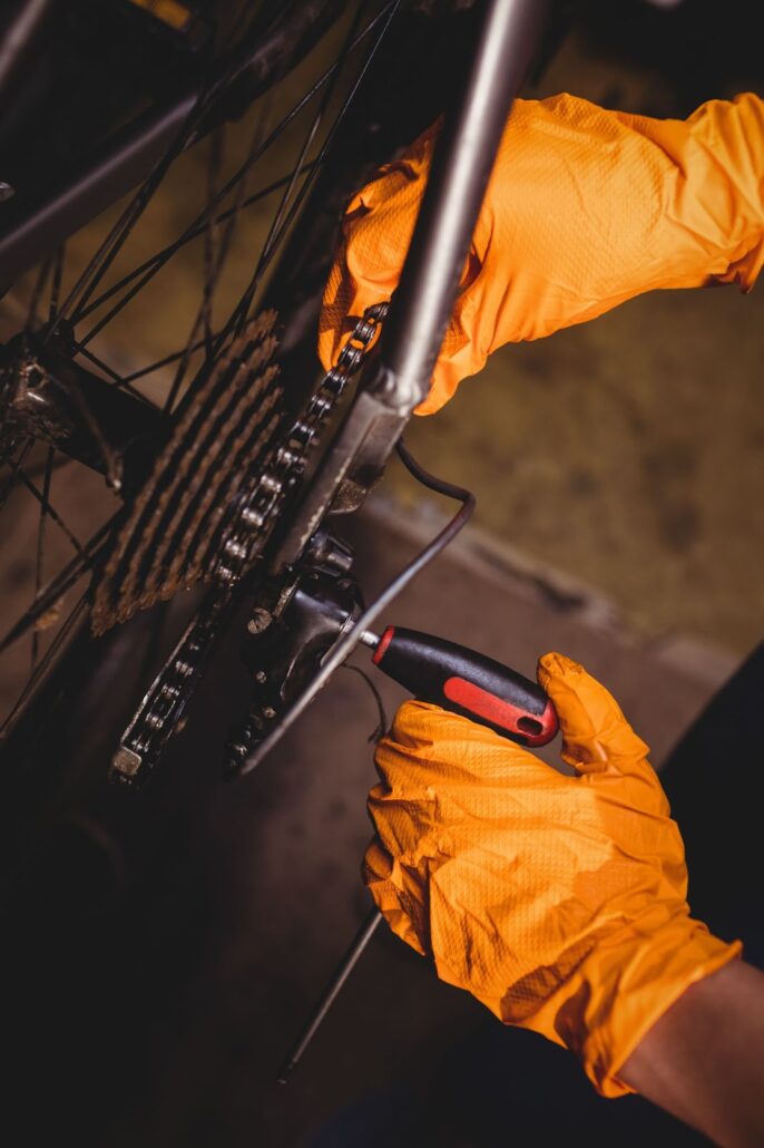 A man fixing a bicycle chain