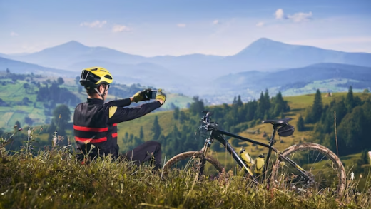 A man takes a picture of a mountain bike