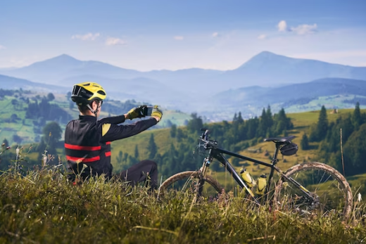 A man takes a picture of a mountain bike